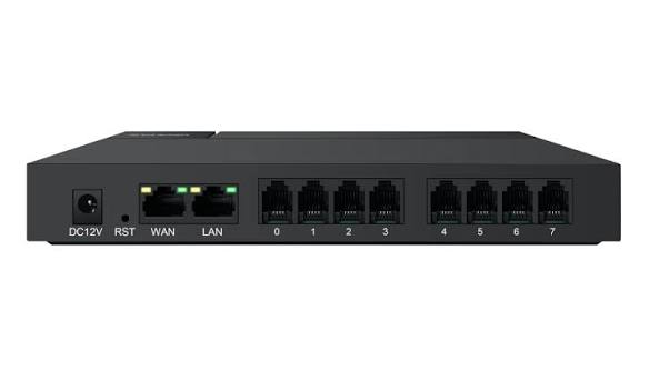 A black 8-port Ethernet switch with labeled ports including DC12V, RST, WAN, LAN, and 0 through 7, shown against a plain white background.